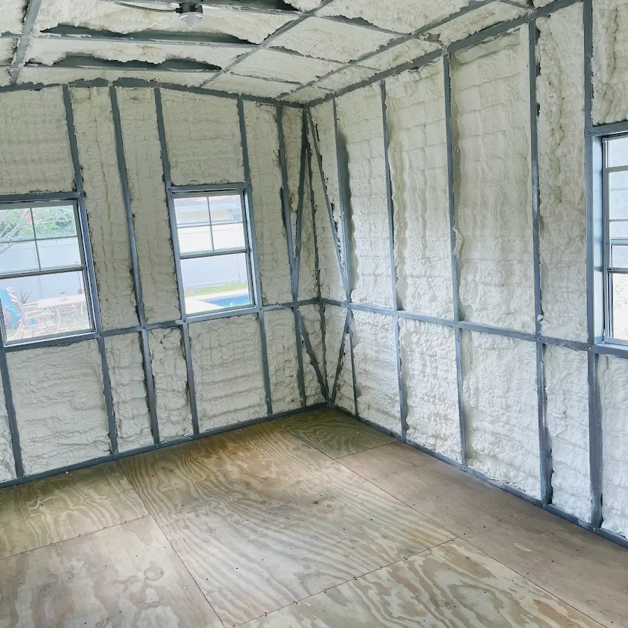 Closed-cell spray foam insulation applied to wall cavities in a residential project in Asheboro